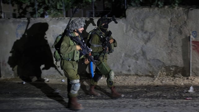 Israeli soldiers during a night raid on the West Bank village of Arura Israeli soldiers during a night raid on the West Bank village of Arura