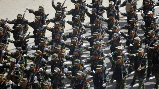 Newly-recruited Iraqi army volunteers take part in a military parade in the shrine city of Najaf, in central Iraq Newly-recruited Iraqi army volunteers take part in a military parade in the shrine city of Najaf, in central Iraq