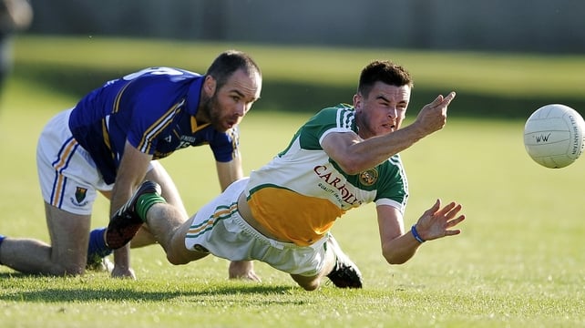 Offaly's Eoin Carroll with Patrick McWalter of Wicklow in Aughrim