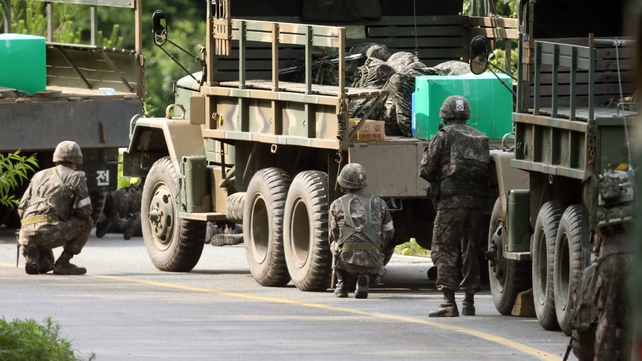 South Korean troops had cornered the soldier in a densely wooded area South Korean troops had cornered the soldier in a densely wooded area