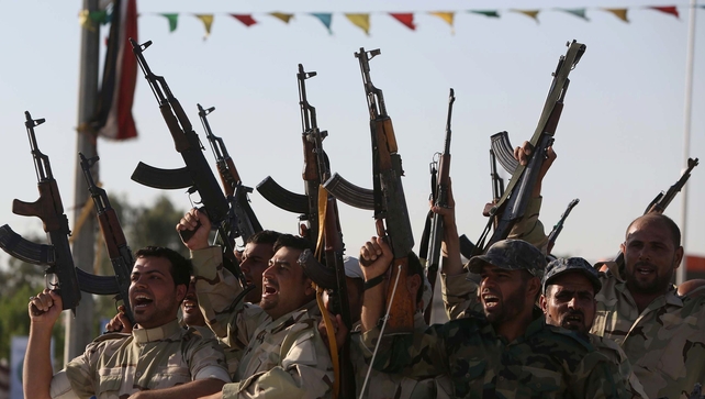 Members of the Al-Abbas brigades who are fighting Sunni militants in the city of Karbala Members of the Al-Abbas brigades who are fighting Sunni militants in the city of Karbala