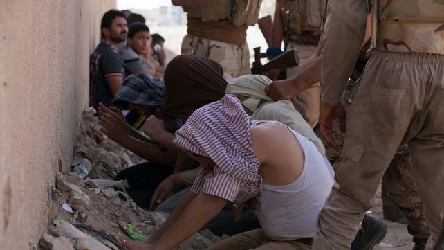 Members of Iraqi security detain supporters of Shia Sheikh Mahmud al-Hassani al-Sarkhi, following clashes in the shrine city of Karbala Members of Iraqi security detain supporters of Shia Sheikh Mahmud al-Hassani al-Sarkhi, following clashes in the shrine city of Karbala