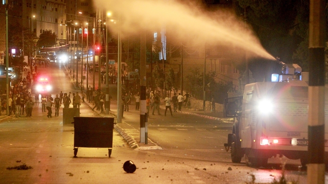 Israeli forces spray sewage from a military vehicle during clashes with stone-throwing Palestinian protesters at a section of the separation barrier to the main entrance of the West Bank city of Bethlehem Israeli forces spray sewage from a military vehicle during clashes with stone-throwing Palestinian protesters at a section of the separation barrier to the main entrance of the West Bank city of Bethlehem