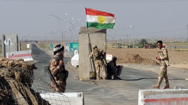 Kurdish Peshmerga forces man a checkpoint on the road leading from Kirkuk to northern Iraqi city of Tikrit Kurdish Peshmerga forces man a checkpoint on the road leading from Kirkuk to northern Iraqi city of Tikrit