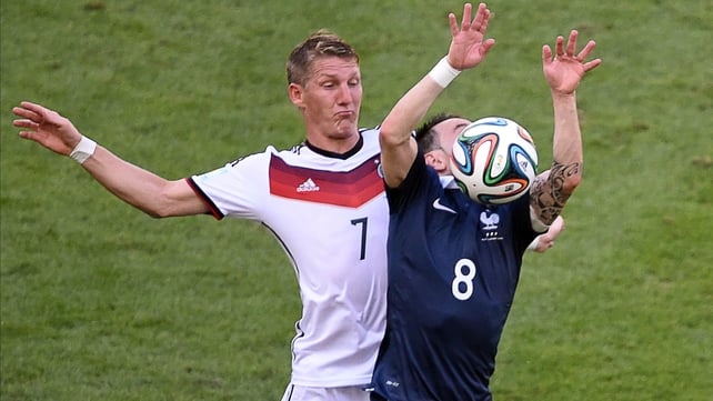 The 6'0 Bastian Schweinsteiger grapples with 5'1 Mathieu Valbuena