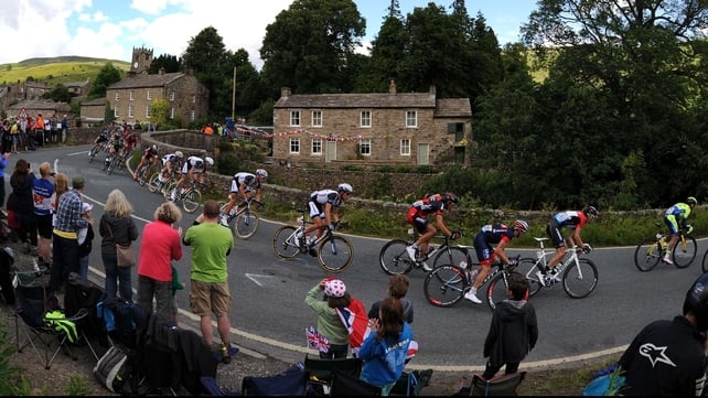 The Peloton passing through the village of Muker, Yorkshire