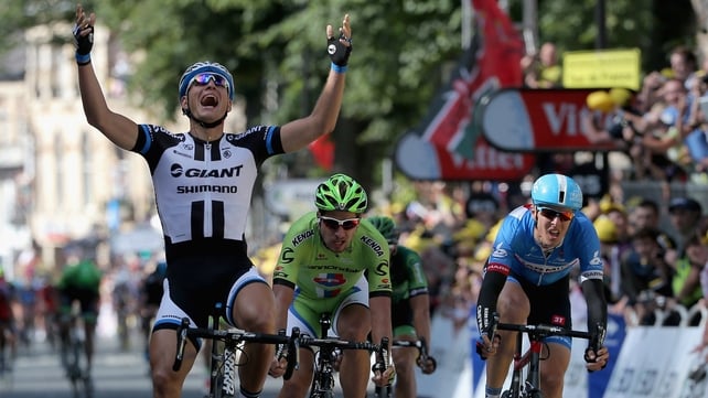 Marcel Kittel of Germany raises his arms as he wins the opening Tour de France stage in Yorkshire