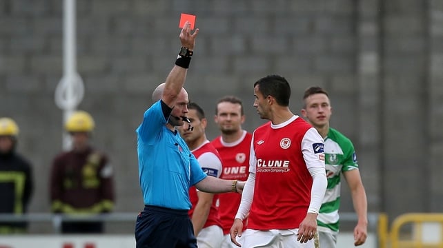 Former Ireland player Keith Fahey receives his marching orders from referee Pádraig Sutton