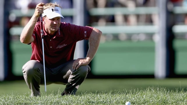 Billy Hurley III lines up a putt on the 18th green