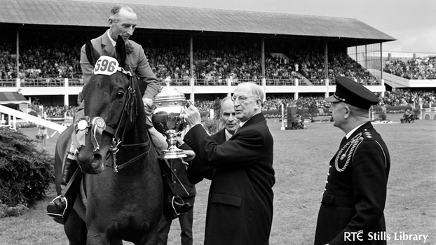President Éamon de Valera presents a trophy to a champion rider. But who is he?