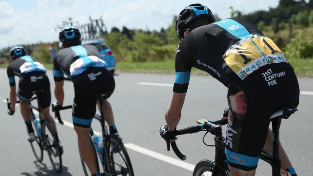 Chris Froome (right) shows the signs of his crash on stage four