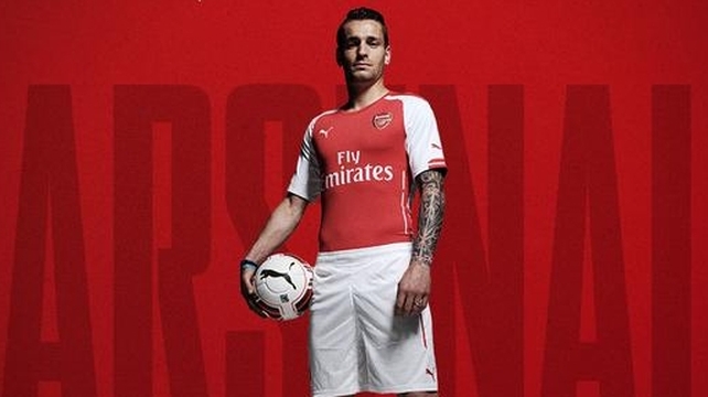 New boy Mathieu Debuchy models the Gunners' kit