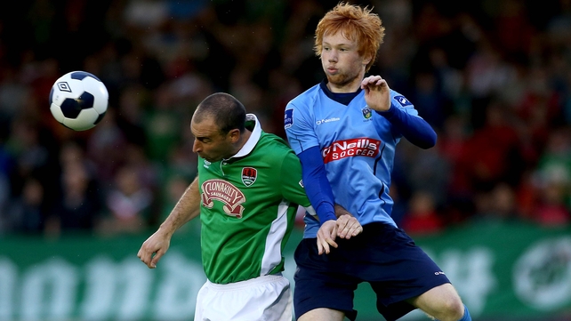 Cork's Dan Murray gets in ahead of Conor Cannon of UCD
