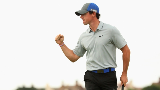 Rory McIlroy celebrates holing his eagle putt on the 16th
