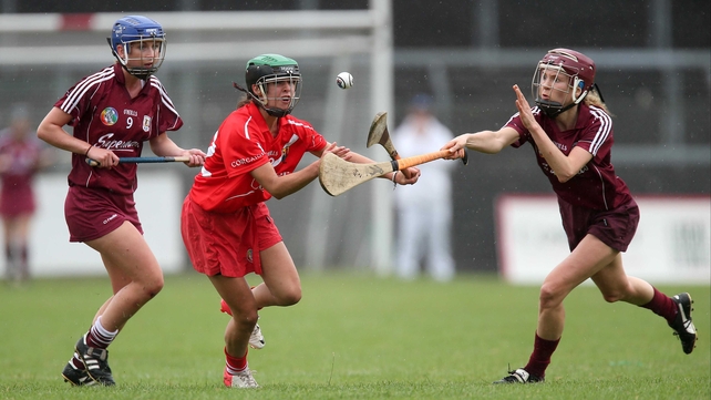 Cork's Julia White with Niamh Kilkenny and Aislinn Connolly of Galway