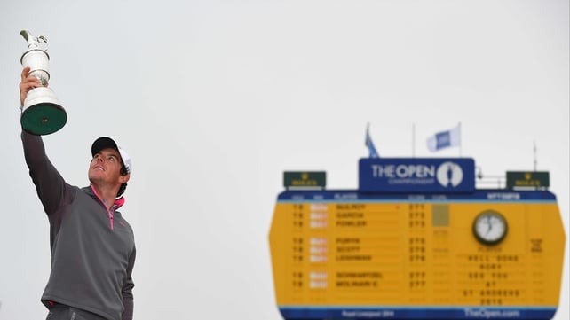 Rory McIlroy holds aloft the famous Claret Jug