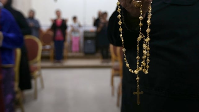 Iraqi Christians who fled the violence in the northern city of Mosul pray at the MarAfram church in the village of Qaraqosh Iraqi Christians who fled the violence in the northern city of Mosul pray at the MarAfram church in the village of Qaraqosh