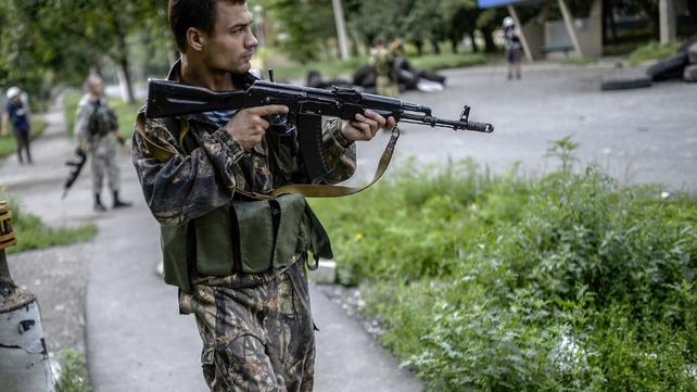 A pro-Russia separatist near the front line in the northern outskirts of city of Donetsk A pro-Russia separatist near the front line in the northern outskirts of city of Donetsk