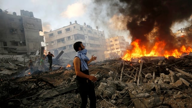 Palestinians inspect the rubble of a destroyed house after Israeli air strikes in Al Tufah neighbourhood Palestinians inspect the rubble of a destroyed house after Israeli air strikes in Al Tufah neighbourhood