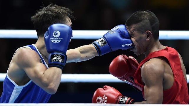 Michael Conlan (L) lands a punch to the face of Nauru's Mathew Martin during their men's bantamweight bout at the SECC Michael Conlan (L) lands a punch to the face of Nauru's Mathew Martin during their men's bantamweight bout at the SECC