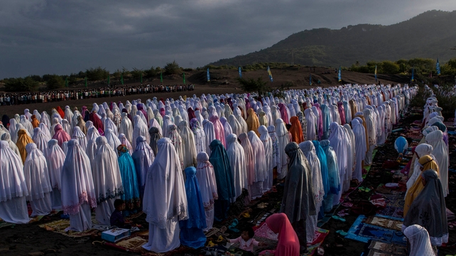 Indonesian Muslims perform Eid al-Fitr prayer on the 'sea of sands' at Parangkusumo beach in Yogyakarta Indonesian Muslims perform Eid al-Fitr prayer on the 'sea of sands' at Parangkusumo beach in Yogyakarta