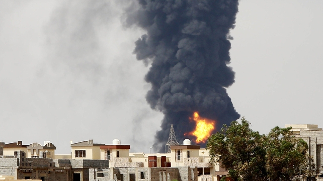 A huge fire erupted at an oil depot outside the Libyan capital today A huge fire erupted at an oil depot outside the Libyan capital today