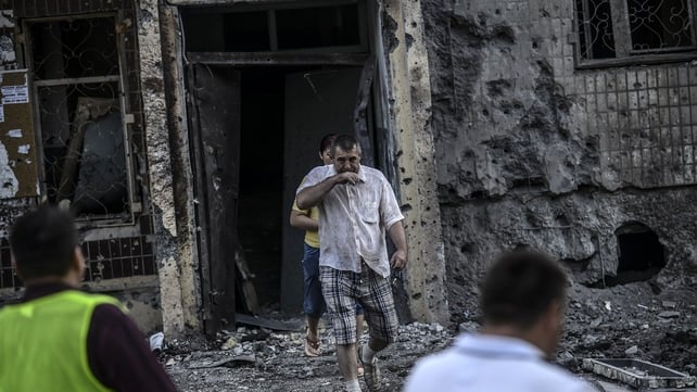 People come out from their houses after shelling in Donetsk People come out from their houses after shelling in Donetsk