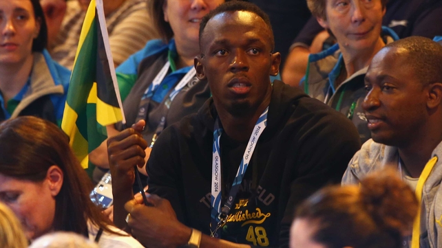 Usain Bolt watches on from the crowd during the preliminary round netball match between New Zealand and Jamaica
