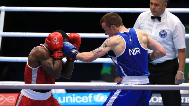 Steven Donnelly penetrates Custio Clayton's defence in Glasgow