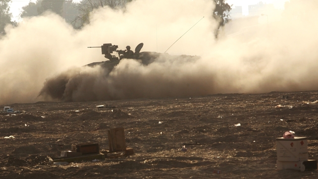 An Israeli Merkava tank rolls along the border between Israel and Hamas-controlled Gaza An Israeli Merkava tank rolls along the border between Israel and Hamas-controlled Gaza