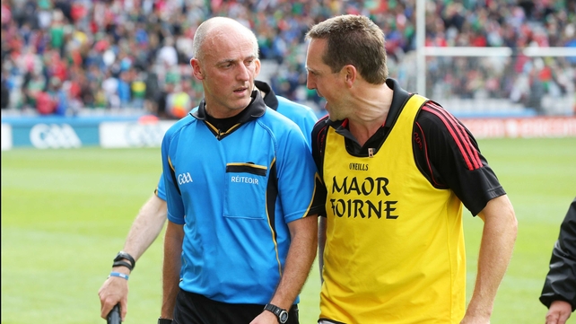 Cork selector Ciaran O'Sullivan confronts referee Cormac Reilly