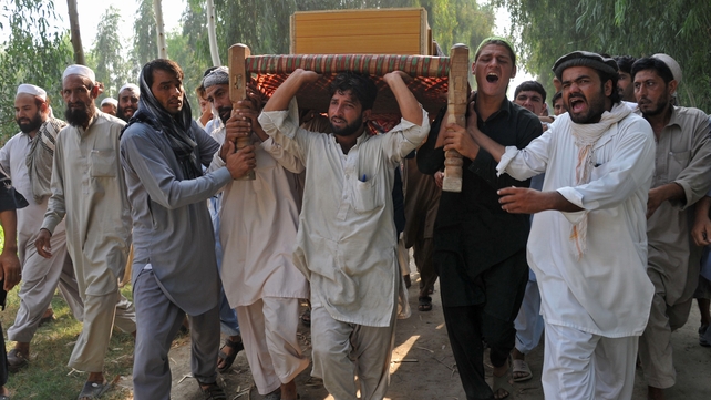 Afghan men carry the coffin of a civilian, allegedly killed in a NATO air strike, on the outskirts of Jalalabad last year Afghan men carry the coffin of a civilian, allegedly killed in a NATO air strike, on the outskirts of Jalalabad last year