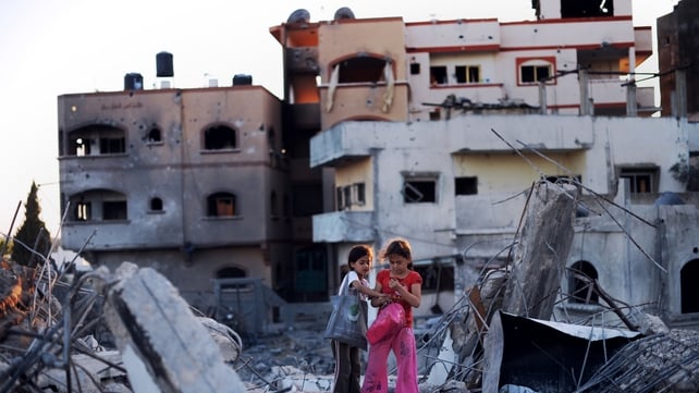 Children look at some of the belonging they salvaged from their destroyed homes in Jabalia, northern Gaza Children look at some of the belonging they salvaged from their destroyed homes in Jabalia, northern Gaza
