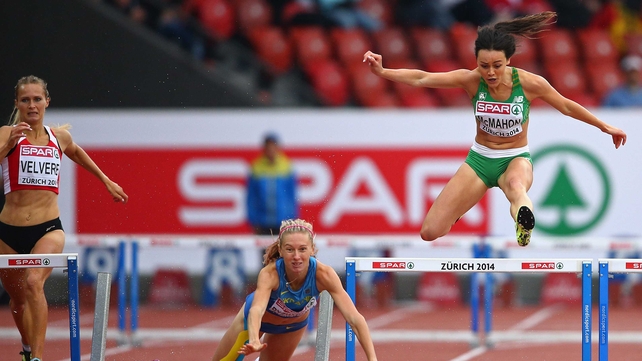 Ireland's Christine McMahon (R) avoids the falling Hanna Ryzhkova of Ukraine