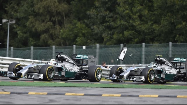Lewis Hamilton (left) and and team-mate Nico Rosberg collide at the Spa-Francorchamps ciruit