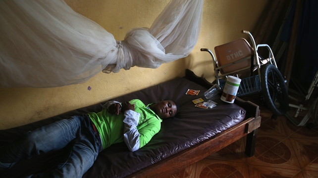 A man lies in an observation room at a government clinic in Dolo Town, Liberia A man lies in an observation room at a government clinic in Dolo Town, Liberia