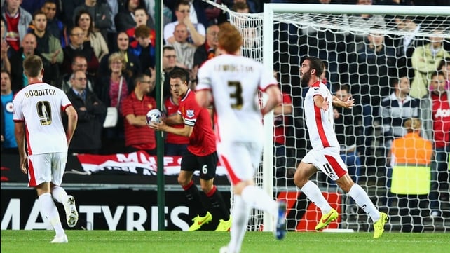 Will Grigg of Milton Keynes Dons celebrates scoring the opening goal