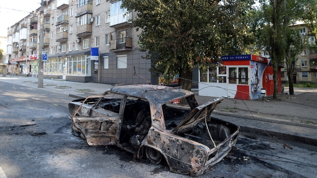 Shelling in Donetsk brought down a tram cable, sitting this car alight and killing three people Shelling in Donetsk brought down a tram cable, sitting this car alight and killing three people