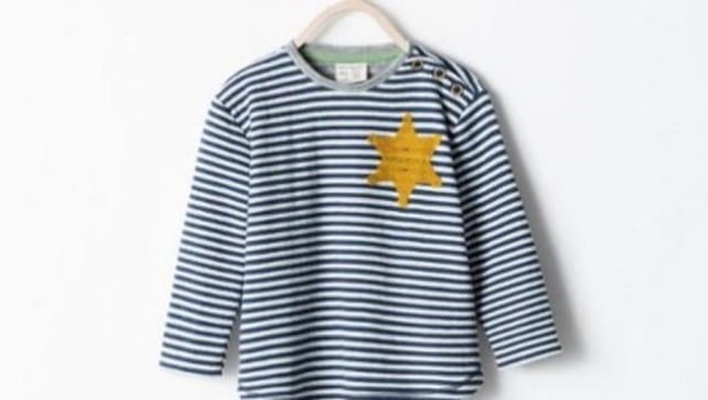 The striped top featured a golden six-pointed star stitched onto the upper left hand side The striped top featured a golden six-pointed star stitched onto the upper left hand side