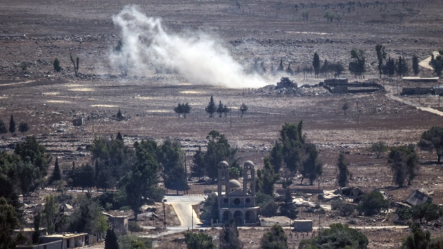 Smoke rises from the Syrian village of Quneitra, as seen from the Israeli-occupied Golan Heights Smoke rises from the Syrian village of Quneitra, as seen from the Israeli-occupied Golan Heights
