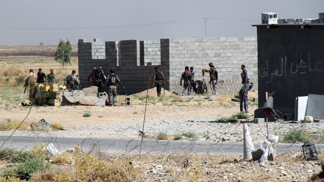 Iraqi and Turkmen fighters hold a position in the beseiged town of Amerli earlier this month Iraqi and Turkmen fighters hold a position in the beseiged town of Amerli earlier this month
