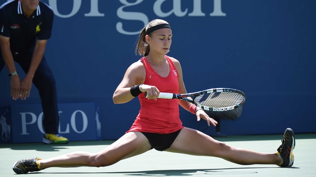 Aleksandra Krunic slides into the splits at Flushing Meadows