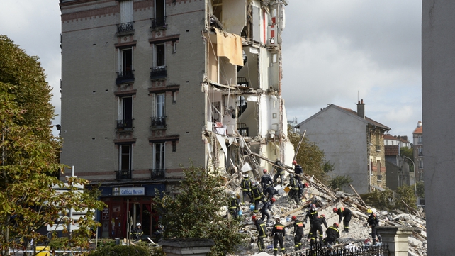 People were evacuated from the rubble of the building in a Paris suburb