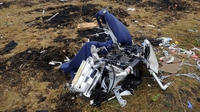 Russian TV says photos show MH17 shot down by jet Russian TV says photos show MH17 shot down by jet