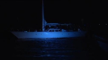 Footage of yacht Makayabella being escorted to shore