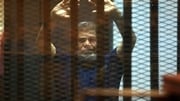 Mohammed Morsi stood defiant in a court cage before the sentences were read out