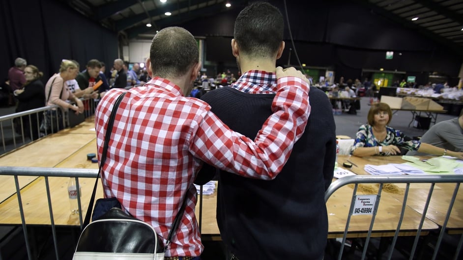 A couple watch the count at a count in Dublin following the vote on same-sex marriage