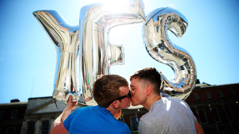 Supporters for same-sex marriage hold an inflatable Yes sign as they wait for the announcement on the referendum