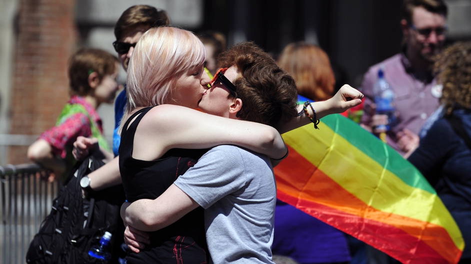 A couple kiss after early results suggest an overwhelming majority in favour of the referendum on same-sex marriage, in Dublin