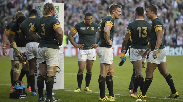 South Africa's dejected players react to defeat against Japan